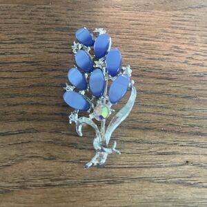 Vintage floral brooch with blue opaque cabochon stones.